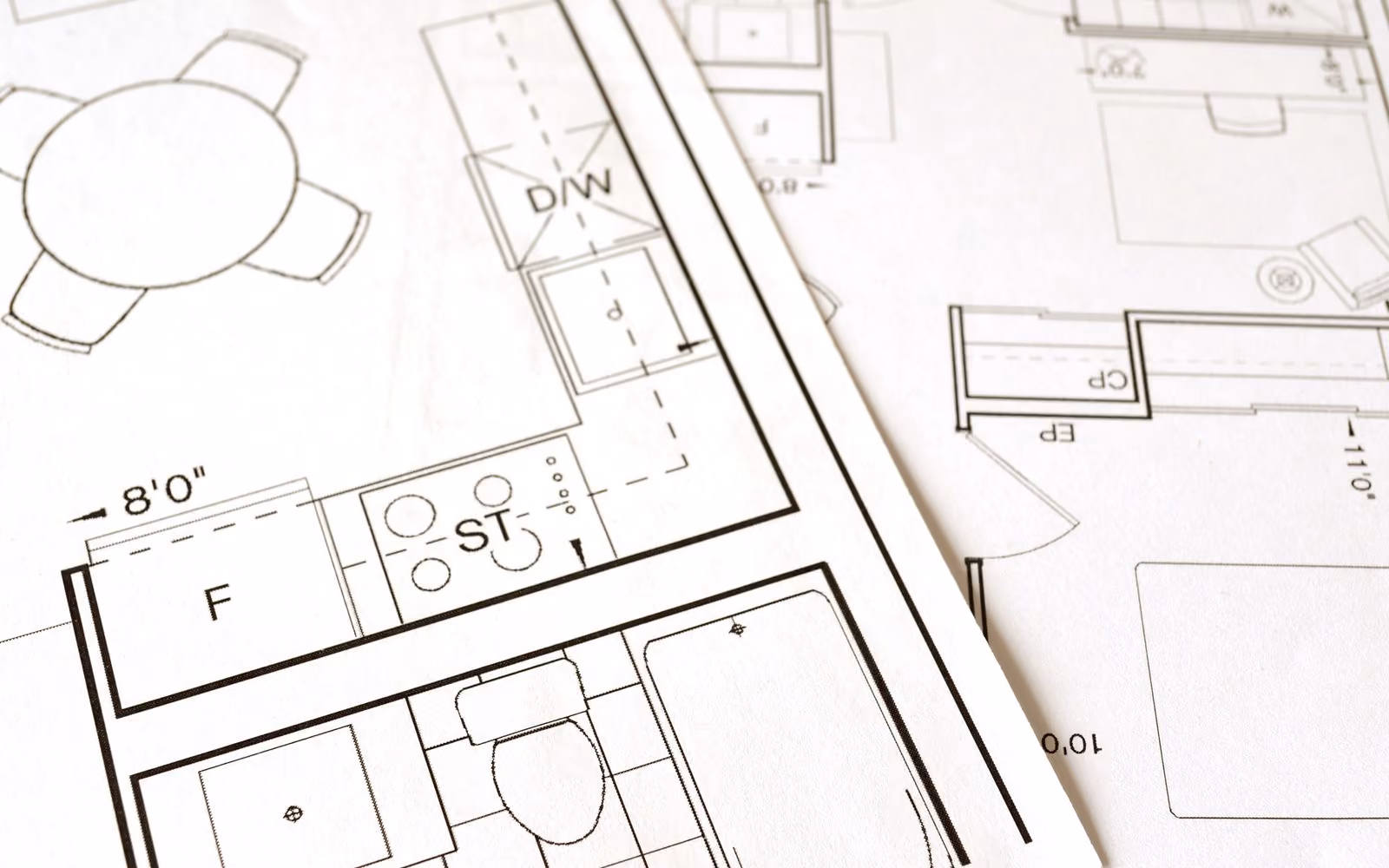 Architectural floor plan blueprint on a desk
