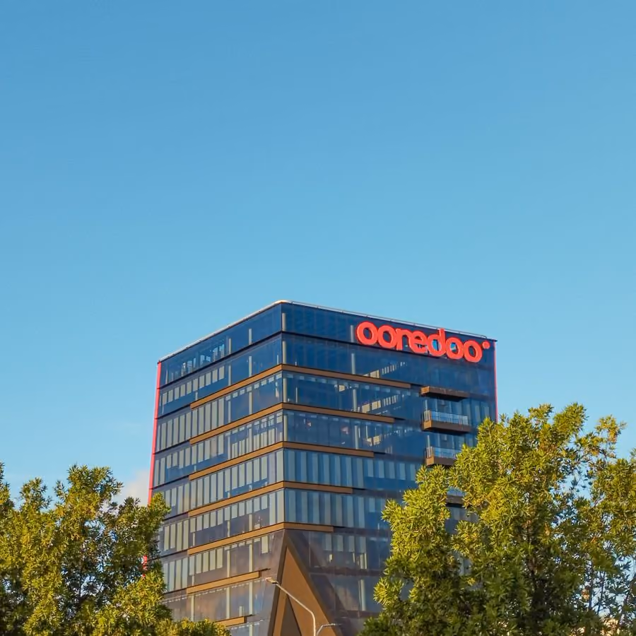 Modern office building with a glass facade (placeholder photo)