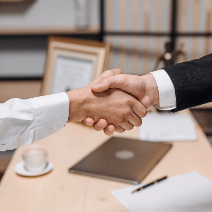 Two people shaking hands on an agreement (placeholder photo)
